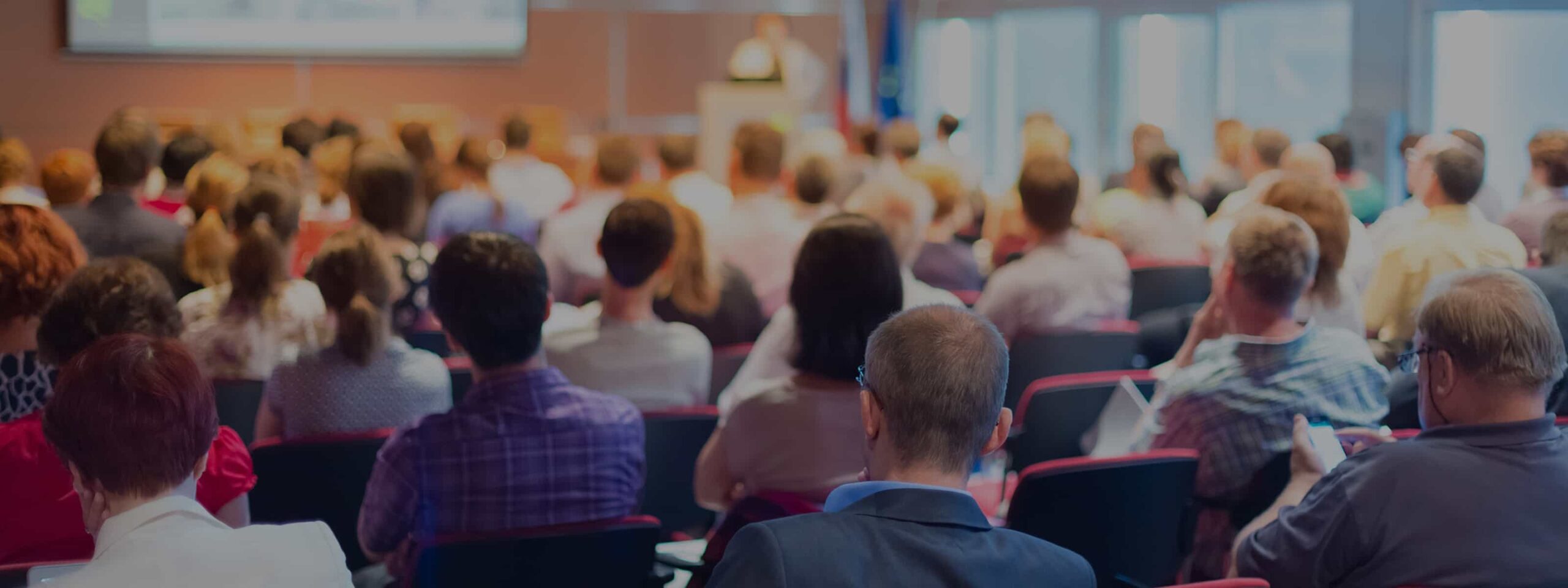 Audience attending a conference session at the 2050 Institute.