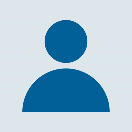 A circle over a bigger semicircle insinuating a placeholder person.