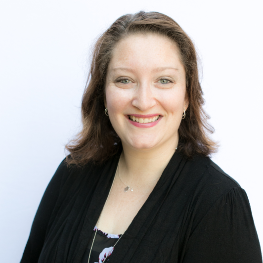 Headshot of Andrea Stein in black jacket