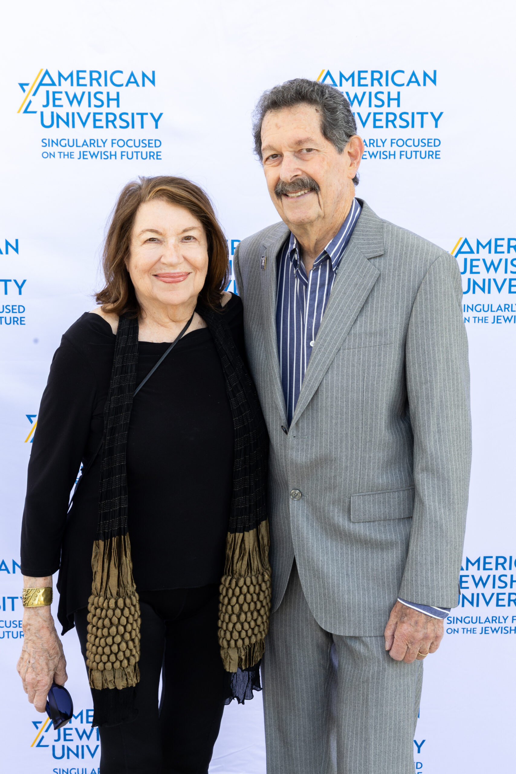 Photo of Couple at step and repeat