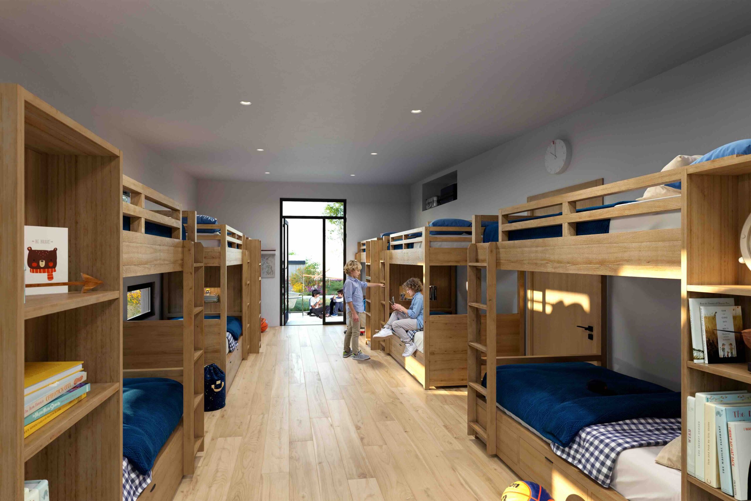 A mockup of a dorm room filled with bunk beds for a future Camp Alonim building.