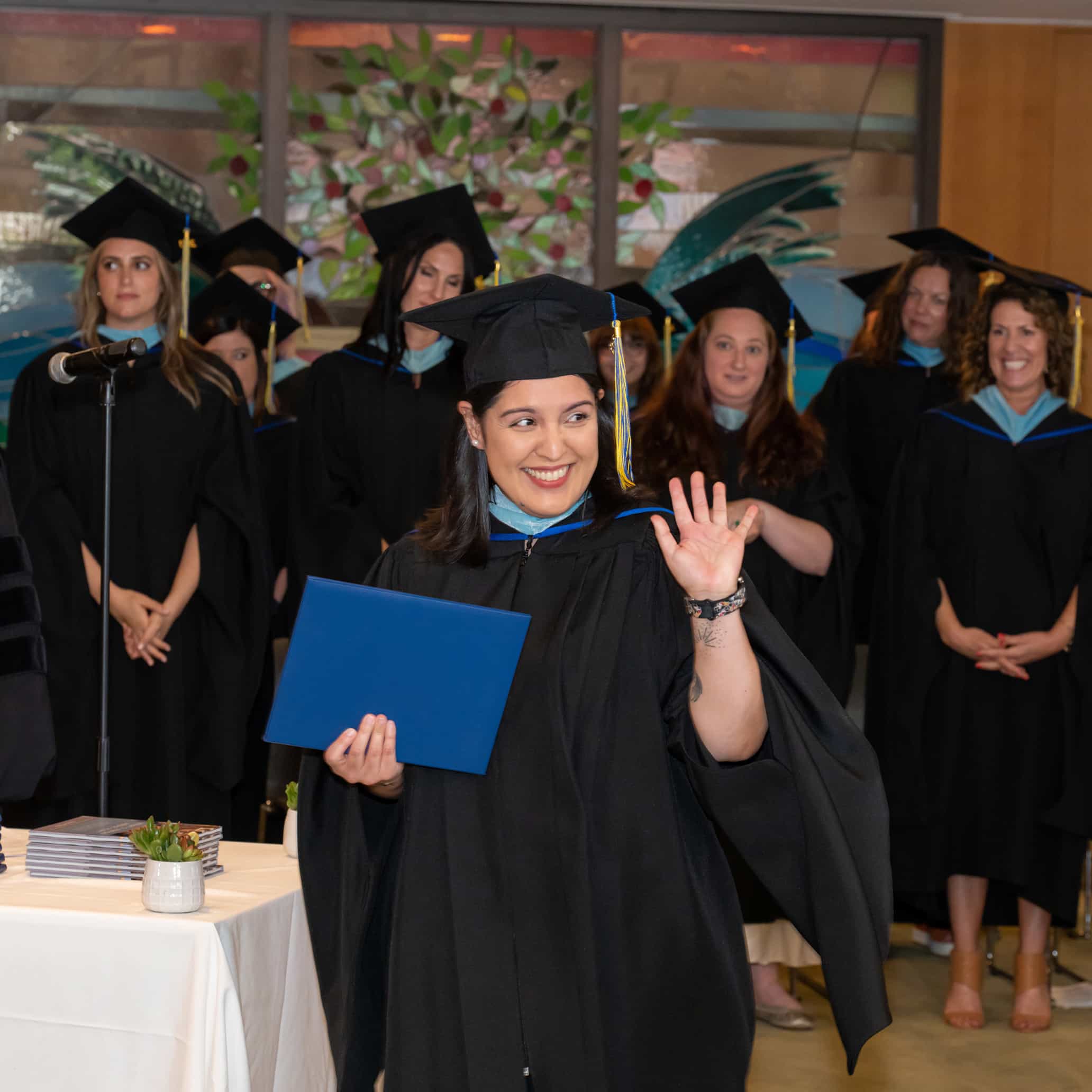 Masor School graduates in caps and gowns at graduation