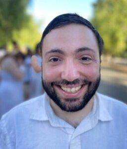 Headshot of Joshua smiling