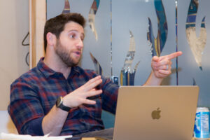 Photo of a Rabbi Daniel Sher mid-lecture