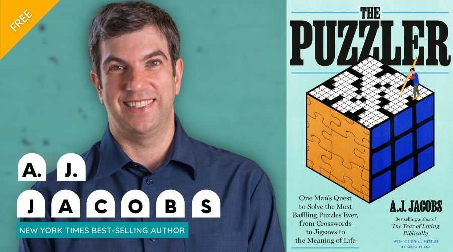 AJ Jacobs posed next to a puzzle cube graphic