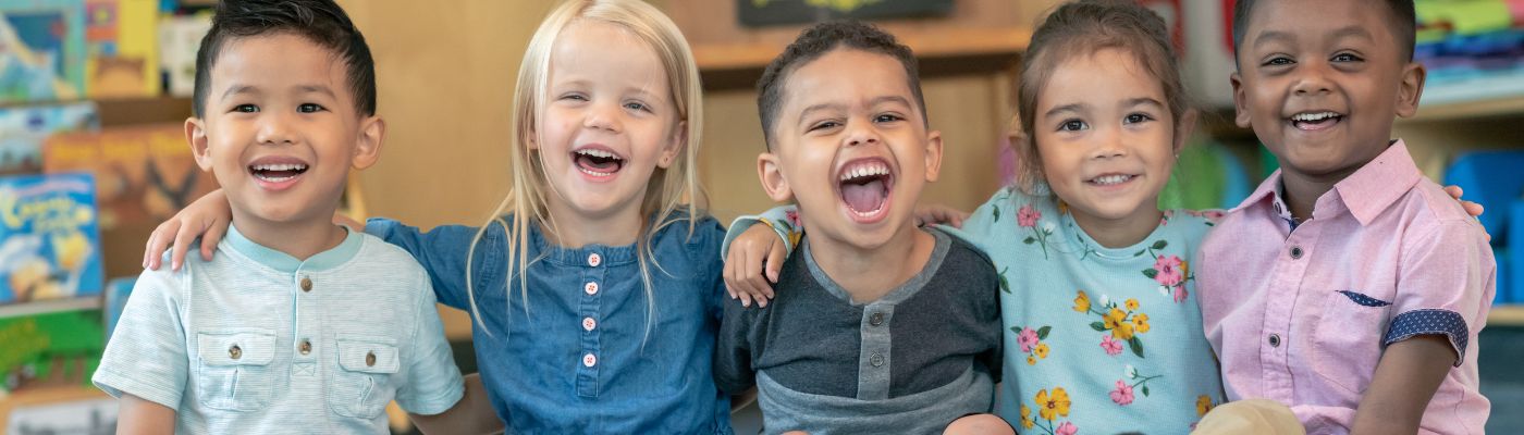 Preschool aged children smiling together