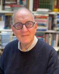 Headshot of Anthony Julius in glasses and black sweater