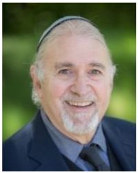 Rabbi Pinchas Giller in black jacket and yarmulke